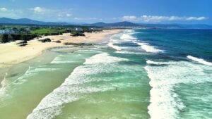 enjoy a breathtaking scenic coastal view showcasing magnificent waves and a sandy beach